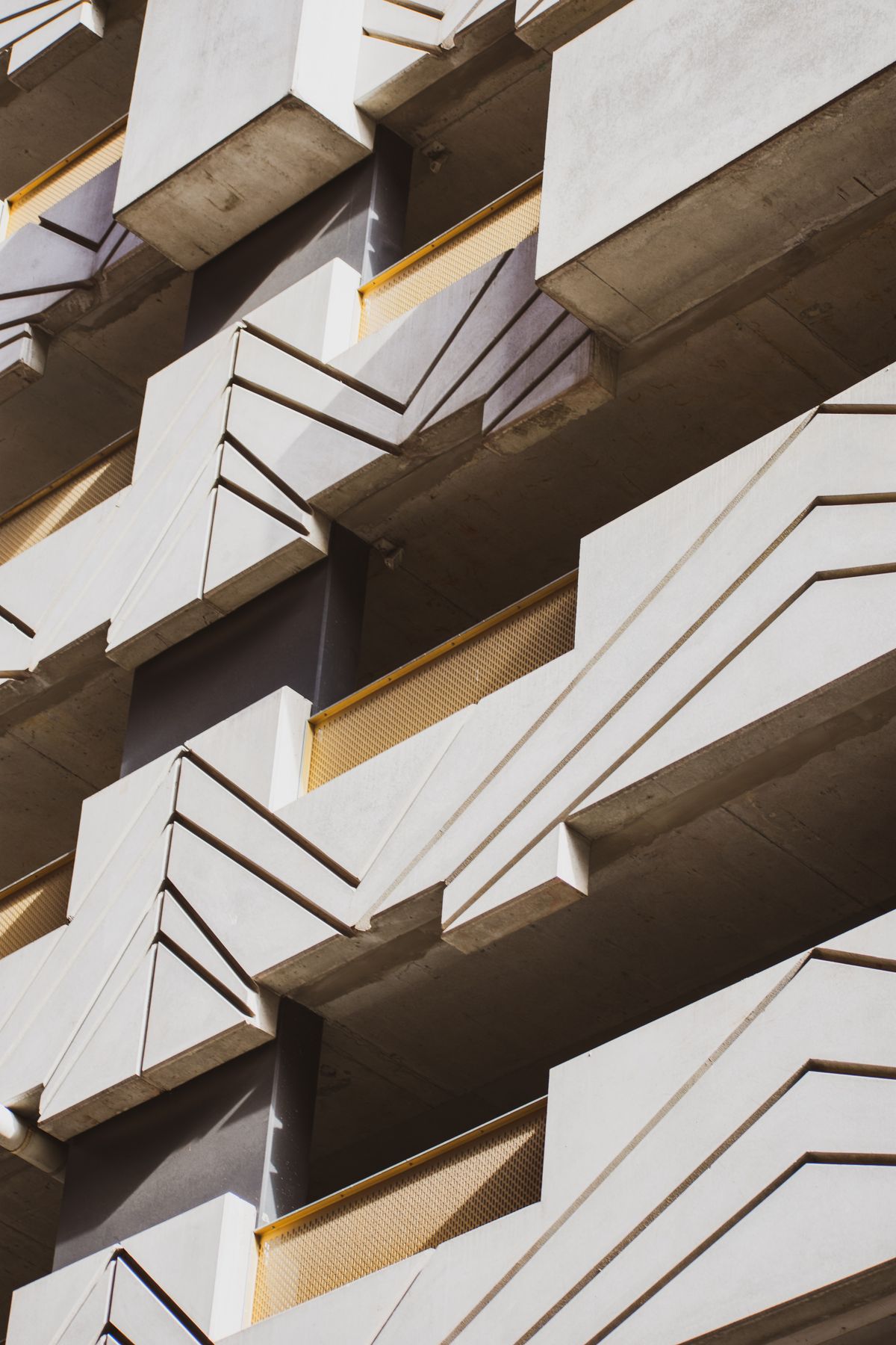 Architectural facade with concrete and geometric patterns.
